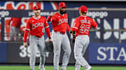 Jun 18, 2025; Bronx, New York, USA; Los Angeles Angels center fielder Jo Adell (7) and first baseman LaMonte Wade Jr. (35) and left fielder Taylor Ward (3) celebrate after defeating the New York Yankees at Yankee Stadium. Mandatory Credit: Vincent Carchietta-Imagn Images