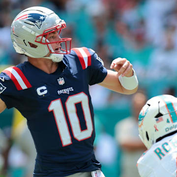 Sep 14, 2025; Miami Gardens, Florida, USA; New England Patriots quarterback Drake Maye (10) passes the football against the Miami Dolphins during the first quarter at Hard Rock Stadium. Mandatory Credit: Sam Navarro-Imagn Images