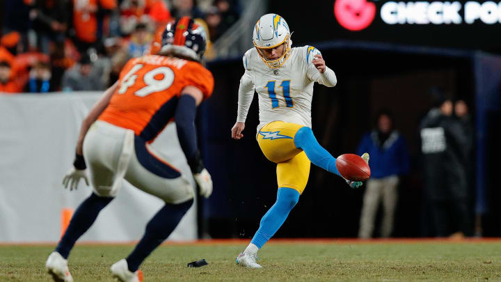 Dec 31, 2023; Denver, Colorado, USA; Los Angeles Chargers place kicker Cameron Dicker (11) attempts an onside kick as Denver Broncos linebacker Alex Singleton (49) defends in the fourth quarter at Empower Field at Mile High. Mandatory Credit: Isaiah J. Downing-USA TODAY Sports