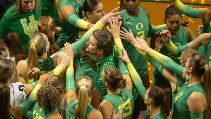 Oregon volleyball coach Matt Ulmer brings his team together during their match against Oregon State in Eugene Friday, Sept. 22, 2023.