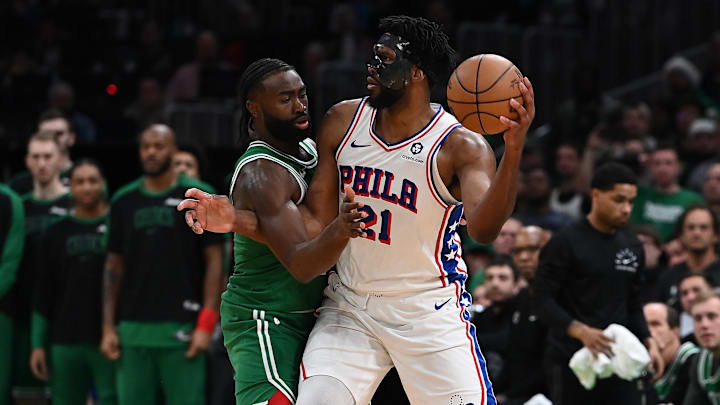 Philadelphia 76ers center Joel Embiid passes the ball against Boston Celtics guard Jaylen Brown. Philadelphia 76ers center Joel Embiid passes the ball against Boston Celtics guard Jaylen Brown.
