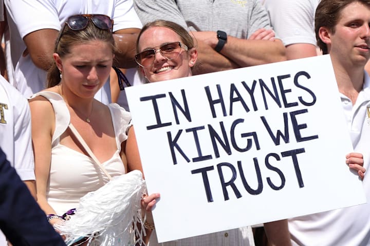 Georgia Tech Yellow Jackets fan holds a sign for quarterback Haynes King against the Clemson Tigers 