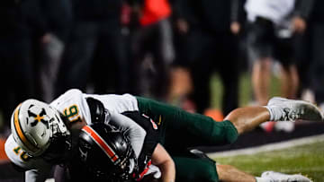 St. Xavier Tigers linebacker Luka Benz (16) tackles Ryle Raiders running back Jacob Savage (21) in the second quarter of a high school football game between the Ryle Raiders and St. Xavier Tigers, Friday, Nov. 15, 2024, at Clifford R. Borland, Sr. Stadium in Union, Ky.