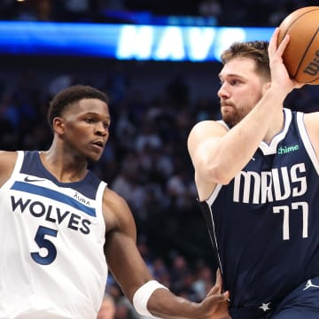 May 28, 2024; Dallas, Texas, USA; Dallas Mavericks guard Luka Doncic (77) dribbles against Minnesota Timberwolves guard Anthony Edwards (5) during the third quarter of game four of the western conference finals for the 2024 NBA playoffs at American Airlines Center. Mandatory Credit: Kevin Jairaj-USA TODAY Sports