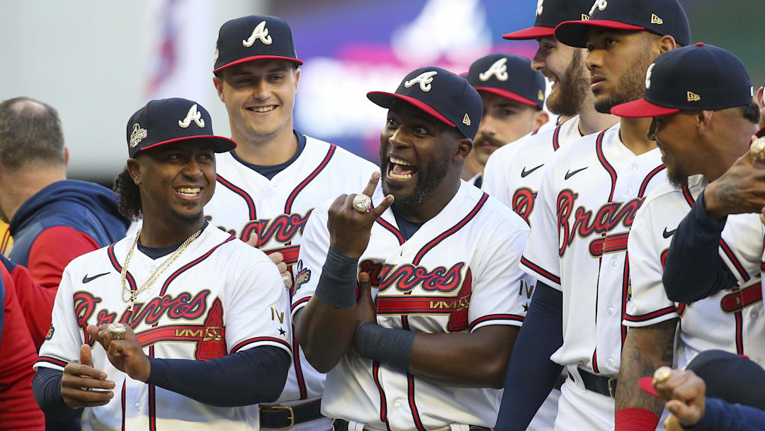 Apr 9, 2022; Atlanta, Georgia, USA; Atlanta Braves second baseman Ozzie Albies (1) and center fielder Guillermo Heredia (38) celebrate after receiving World Series championship rings before a game against the Cincinnati Reds at Truist Park. Mandatory Credit: Brett Davis-Imagn Images
