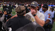 Nov 28, 2025; Atlanta, Georgia, USA; Georgia Bulldogs head coach Kirby Smart talks to Georgia Tech Yellow Jackets head coach Brent Key after a game at Mercedes-Benz Stadium. Mandatory Credit: Brett Davis-Imagn Images