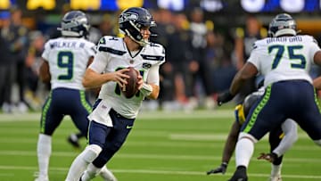 Nov 16, 2025; Inglewood, California, USA; Seattle Seahawks quarterback Sam Darnold (14) drops back to pass during the first half against the Los Angeles Rams at SoFi Stadium. 