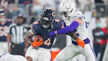 Dec 16, 2024; Minneapolis, Minnesota, USA; Chicago Bears running back D'Andre Swift (4) runs with the ball against the Minnesota Vikings in the third quarter at U.S. Bank Stadium. Mandatory Credit: Brad Rempel-Imagn Images