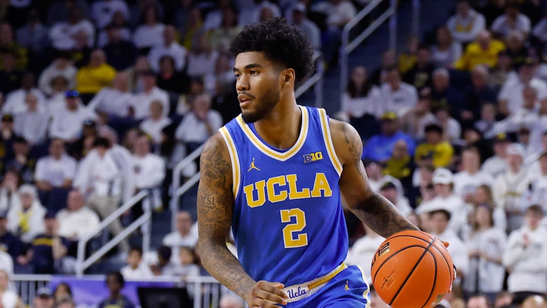 Feb 14, 2026; Ann Arbor, Michigan, USA;  UCLA Bruins guard Donovan Dent (2) dribbles against the Michigan Wolverines at Crisler Center. Mandatory Credit: Rick Osentoski-Imagn Images
