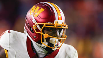 Washington Commanders wide receiver Deebo Samuel after a reception defended by Denver Broncos cornerback Riley Moss.