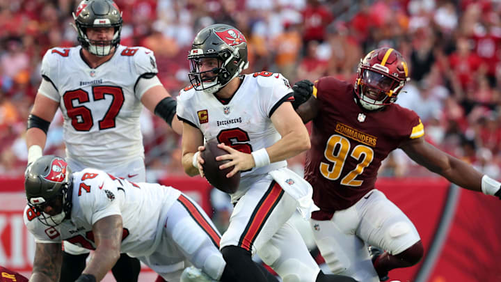 Sep 8, 2024; Tampa, Florida, USA;  Tampa Bay Buccaneers quarterback Baker Mayfield (6) runs with the ball against the Washington Commanders during the second half at Raymond James Stadium. Mandatory Credit: Kim Klement Neitzel-Imagn Images