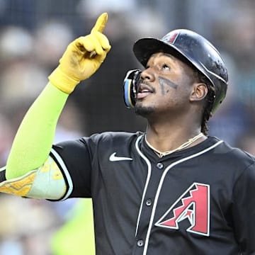 Jul 9, 2025; San Diego, California, USA; Arizona Diamondbacks shortstop Geraldo Perdomo (2) points skyward after hitting a grand slam during the fifth inning against the San Diego Padres at Petco Park. Mandatory Credit: Denis Poroy-Imagn Images