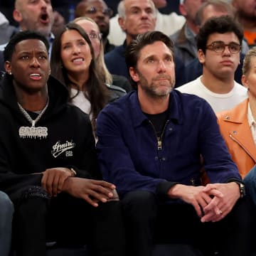 May 2, 2023; New York, New York, USA; New York Jets quarterback Aaron Rodgers (left to right) and cornerback Sauce Gardner sit next to New York Rangers former goaltender Henrik Lundqvist during the second quarter of game two of the 2023 NBA Eastern Conference semifinal playoffs between the New York Knicks and the Miami Heat at Madison Square Garden. Mandatory Credit: Brad Penner-USA TODAY Sports