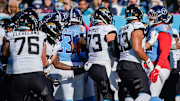 There’s a scuffle on the sidelines after a late hit on Jacksonville Jaguars quarterback Trevor Lawrence (16) by Tennessee Titans linebacker Arden Key (49) during the second quarter at Nissan Stadium in Nashville, Tenn., Sunday, Nov. 30, 2025.