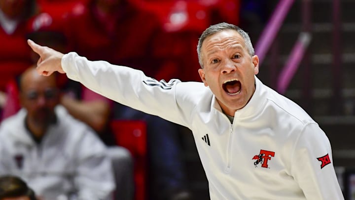 Jan 4, 2025; Salt Lake City, Utah, USA; Texas Tech Red Raiders head coach Grant McCasland makes a call during the second half against the Utah Utes at the Jon M. Huntsman Center. Mandatory Credit: Christopher Creveling-Imagn Images