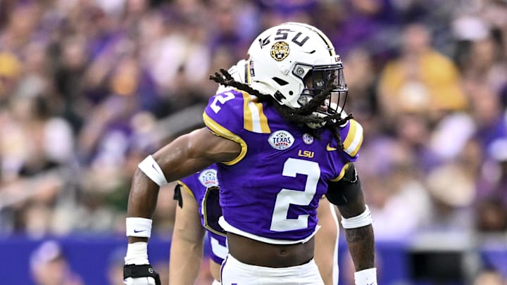 Dec 31, 2024; Houston, TX, USA; LSU Tigers safety Jardin Gilbert (2) reacts after making a tackle during the first quarter against the Baylor Bears at NRG Stadium. Mandatory Credit: Maria Lysaker-Imagn Images 