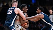 Virginia forward Thijs De Ridder (28) and guard Malik Thomas (1) trap Vanderbilt forward AK Okereke (10) during the second half of their exhibition game at Memorial Gym in Nashville, Tenn., Thursday, Oct. 16, 2025.
