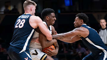 Virginia forward Thijs De Ridder (28) and guard Malik Thomas (1) trap Vanderbilt forward AK Okereke (10) during the second half of their exhibition game at Memorial Gym in Nashville, Tenn., Thursday, Oct. 16, 2025.