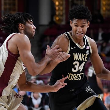 Jan 14, 2023; Chestnut Hill, Massachusetts, USA; Wake Forest Demon Deacons forward Bobi Klintman (34) drives the ball  during the first half against the Boston College Eagles at Conte Forum. Mandatory Credit: Eric Canha-USA TODAY Sports
