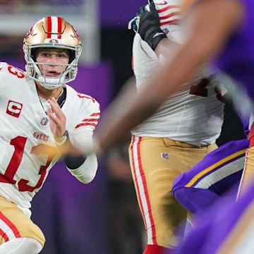 Oct 23, 2023; Minneapolis, Minnesota, USA; San Francisco 49ers quarterback Brock Purdy (13) scrambles against the Minnesota Vikings in the fourth quarter at U.S. Bank Stadium. Mandatory Credit: Brad Rempel-Imagn Images