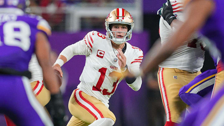 Oct 23, 2023; Minneapolis, Minnesota, USA; San Francisco 49ers quarterback Brock Purdy (13) scrambles against the Minnesota Vikings in the fourth quarter at U.S. Bank Stadium. Mandatory Credit: Brad Rempel-Imagn Images