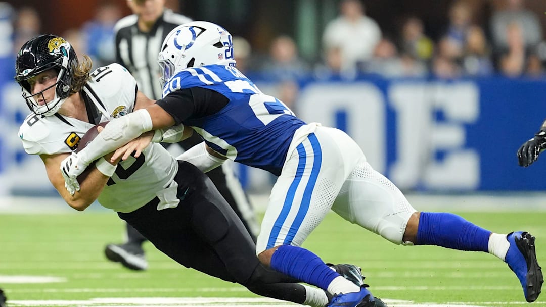 Indianapolis Colts safety Nick Cross (20) wraps up Jacksonville Jaguars quarterback Trevor Lawrence (16) on Sunday, Dec. 28, 2025, during a game at Lucas Oil Stadium in Indianapolis.