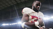 Arizona Cardinals running back Trey Benson (33) walks off the field after their 23-20 loss to the Seattle Seahawks at State Farm Stadium in Glendale on Sept. 25, 2025.