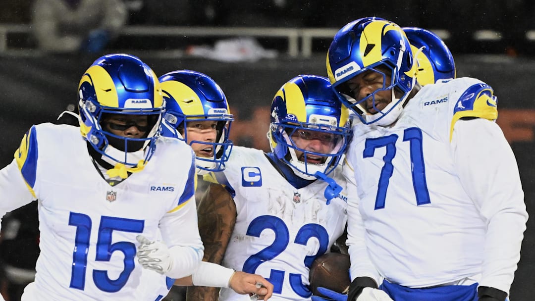Jan 18, 2026; Chicago, IL, USA; Los Angeles Rams running back Kyren Williams (23) celebrates with wide receiver Konata Mumpfield (15), quarterback Matthew Stafford (9) and offensive tackle Warren McClendon Jr. (71) after scoring a touchdown against the Chicago Bears during the fourth quarter of an NFC Divisional Round game at Soldier Field. Mandatory Credit: Matt Marton-Imagn Images