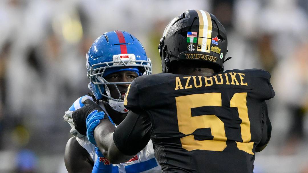 Oct 10, 2026; Nashville, Tennessee, USA;  Vanderbilt Commodores offensive lineman Clinton Azubuike (51) \blocks Mississippi Rebels defensive end Landon Barnes (15) during the second half at FirstBank Stadium.  Mandatory Credit: Steve Roberts-Imagn Images