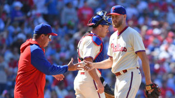 Apr 14, 2024; Philadelphia, Pennsylvania, USA; Philadelphia Phillies pitcher Zack Wheeler (45) hands the ball to manager Rob Thomson (59) after giving up a grands slam hime run against the Pittsburgh Pirates during the sixth inning at Citizens Bank Park.