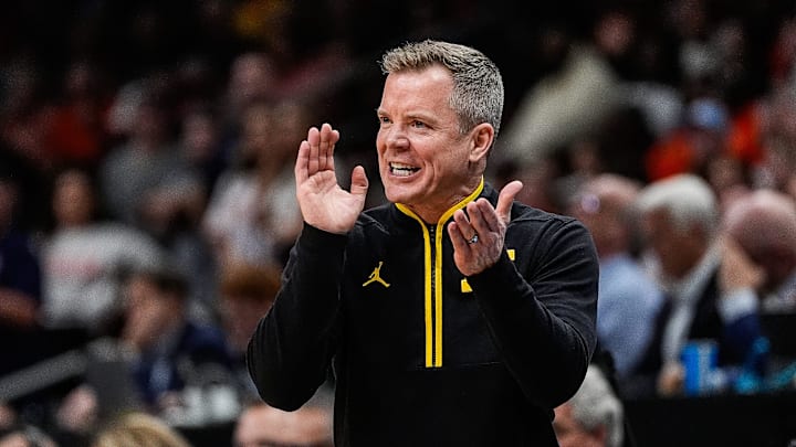 Michigan head coach Dusty May cheers on after a play against Auburn during the second half of the Sweet 16 round of NCAA tournament at State Farm Arena in Atlanta, Ga. on Friday, March 28, 2025.