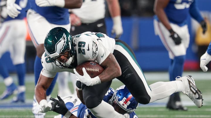 Oct 9, 2025; East Rutherford, New Jersey, USA; Philadelphia Eagles running back AJ Dillon (29) avoids a tackle by New York Giants linebacker Bobby Okereke (58) during the fourth quarter of the game at MetLife Stadium. Mandatory Credit: Vincent Carchietta-Imagn Images