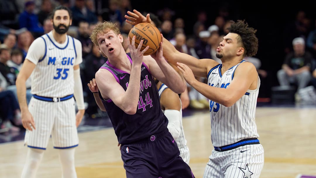 Mar 7, 2026; Minneapolis, Minnesota, USA; Minnesota Timberwolves center Rocco Zikarsky (44) looks to shoot as Orlando Magic forward Noah Penda (93) defends in the fourth quarter at Target Center. Mandatory Credit: Matt Blewett-Imagn Images
