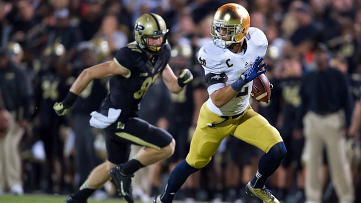 Sep 14, 2013; West Lafayette, IN, USA; Notre Dame Fighting Irish cornerback Bennett Jackson (2) runs for a touchdown after intercepting a pass intended for Purdue Boilermakers wide receiver Shane Mikeskey (87) in the fourth quarter at Ross-Ade Stadium. Notre Dame won 31-24. 