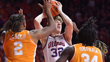 Dec 14, 2024; Champaign, Illinois, USA;  Tennessee Volunteers guard Chaz Lanier (2) and teammate Felix Okpara (34) guard Illinois Fighting Illini guard Kasparas Jakucionis (32) with the ball during the first half at State Farm Center. Mandatory Credit: Ron Johnson-Imagn Images