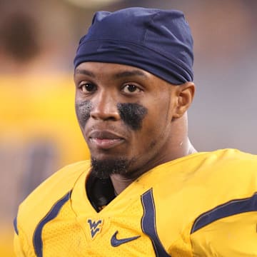 December 1, 2012; Morgantown, WV, USA; West Virginia Mountaineers wide receiver Tavon Austin (1) looks on from the sidelines against the Kansas Jayhawks during the fourth quarter at Milan Puskar Stadium. The West Virginia Mountaineers won 59-10. Mandatory Credit: Charles LeClaire-Imagn Images