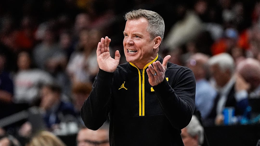Michigan head coach Dusty May cheers on after a play against Auburn during the second half of the Sweet 16 round of the NCAA tournament at State Farm Arena on Friday, March 28, 2025.