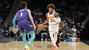 Mar 20, 2025; Charlotte, North Carolina, USA; New York Knicks guard Miles McBride (2) brings the ball up court against Charlotte Hornets guard LaMelo Ball (1)  during the first quarter at Spectrum Center. Mandatory Credit: Jim Dedmon-Imagn Images
