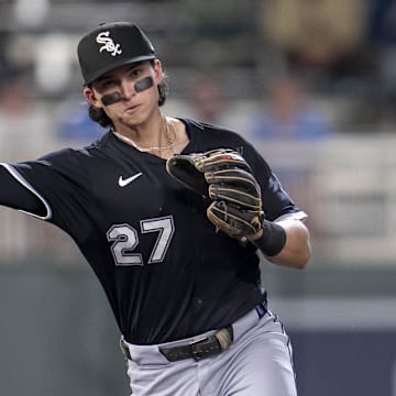 Chicago White Sox second baseman Brooks Baldwin (27) throws the ball to first base against the Minnesota Twins at Target Field. 