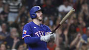 Texas Rangers pinch hitter Jonah Heim (28) hits a home run during the eighth inning against the Houston Astros at Daikin Park. 