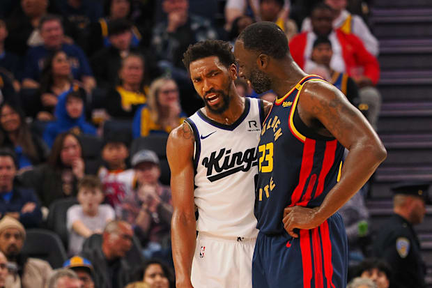 Sacramento Kings guard Malik Monk (0) and Golden State Warriors forward Draymond Green (23)