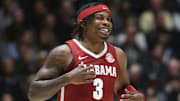 Alabama Crimson Tide guard Latrell Wrightsell Jr. (3) smiles while jogging onto the court Friday, Nov. 15, 2024, during the NCAA men’s basketball game against the Purdue Boilermakers at Mackey Arena in West Lafayette, Ind. Purdue Boilermakers won 87-78.