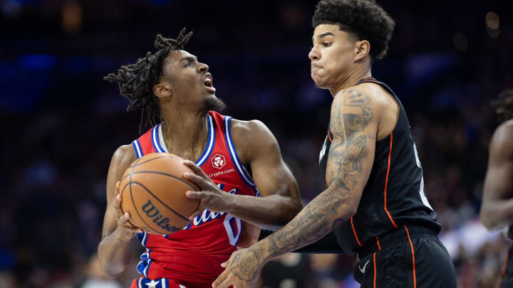 Dec 15, 2023; Philadelphia, Pennsylvania, USA; Philadelphia 76ers guard Tyrese Maxey (0) drives against Detroit Pistons guard Killian Hayes (7) during the first quarter at Wells Fargo Center. Mandatory Credit: Bill Streicher-USA TODAY Sports