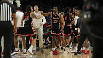 Houston players Emanuel Sharp (21) and Terrance Arceneaux (23) congratulate one another after the Cougars' Final Four win against Duke on April 5, 2025.