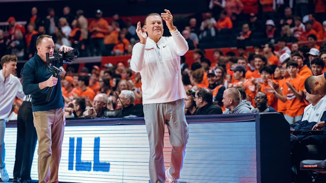 Illinois men's basketball coach Brad Underwood applauds during the Illini's 113-55 season-opening win over Jackson State on Monday at the State Farm Center in Champaign, Illinois.
