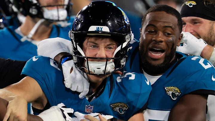 Jacksonville Jaguars place kicker Cam Little (39) is celebrated for his 70-yard field goal by cornerback Jarrian Jones (22) and others during the second quarter of an NFL preseason matchup at EverBank Stadium, Saturday, Aug. 9, 2025 in Jacksonville, Fla. [Corey Perrine/Florida Times-Union]