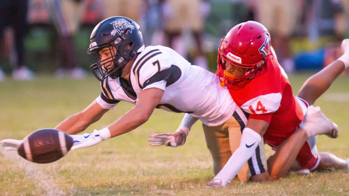 Buchholz Bobcats Keil McGriff (7) is brought down by Vanguard Lem’marius Woolbright after he was called for pass interference. The Vanguard Knights hosted the Buchholz Bobcats at Booster Stadium in Ocala, FL on Friday, August 23, 2024. Buchholz lead at the half 17-7. [Doug Engle/Ocala Star Banner]