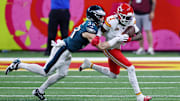 Feb 9, 2025; New Orleans, LA, USA; Kansas City Chiefs wide receiver Xavier Worthy (1) runs with the ball against Philadelphia Eagles cornerback Cooper DeJean (33) during the first half of Super Bowl LIX at Caesars Superdome.