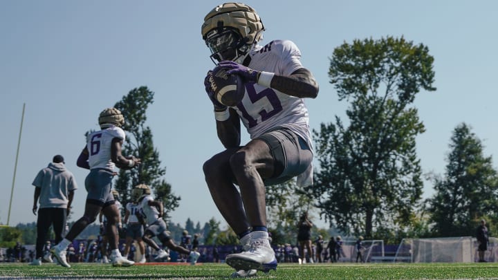 Keith Reynolds tap dances on the sideline after a fall camp catch.