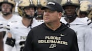 Purdue Boilermakers head coach Barry Odom takes the field with his team